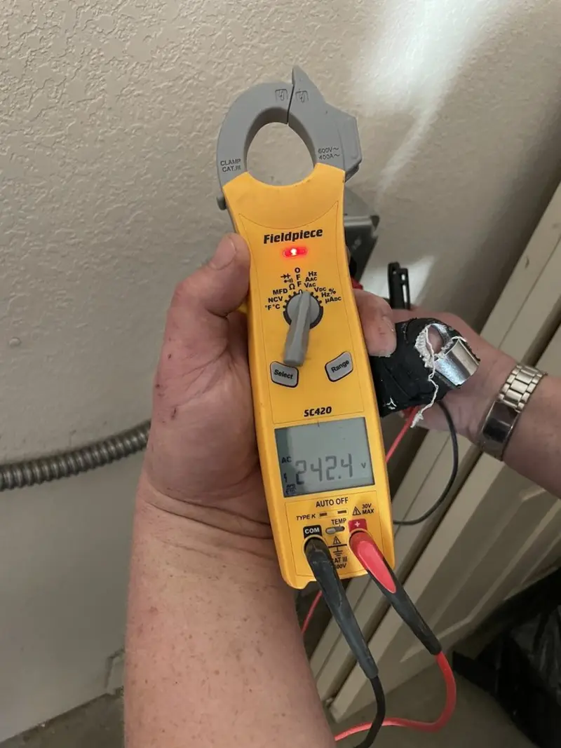 Voltage testing with clamp meter during Ceiling Fan Installation in Wappingers Falls